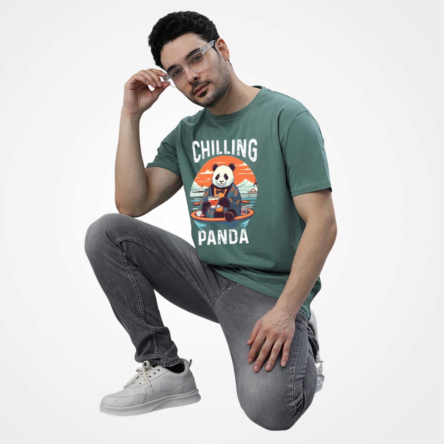 Man wearing a WYO mint t-shirt with 'Chilling Panda' design on a light gray background