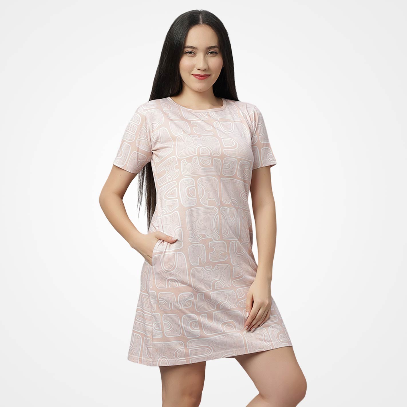 Woman wearing a WYO light pink dress with geometric pattern on a white background