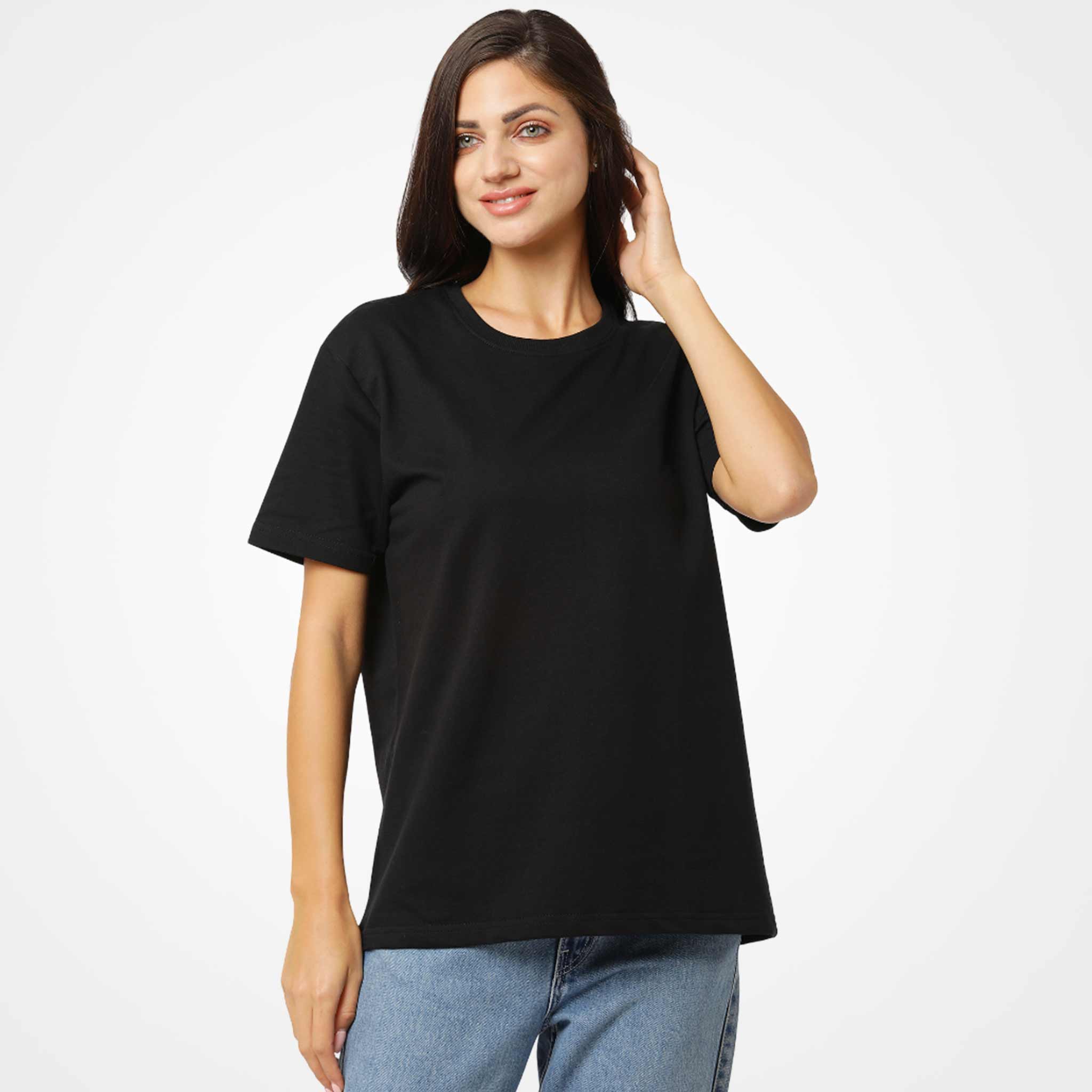 Woman wearing a WYO black t-shirt and blue jeans on a white background