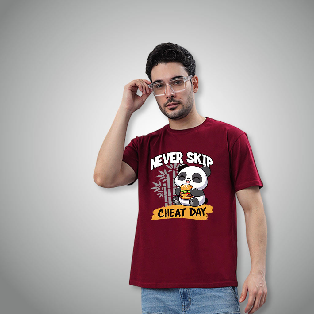 Man wearing a WYO maroon t-shirt with a panda graphic and text on a gray background