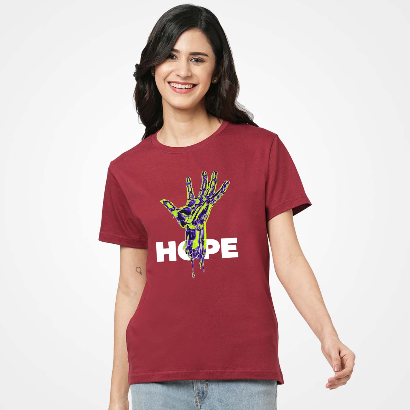 Woman wearing a WYO maroon t-shirt with a colorful hand design and 'HOPE' text on a white background