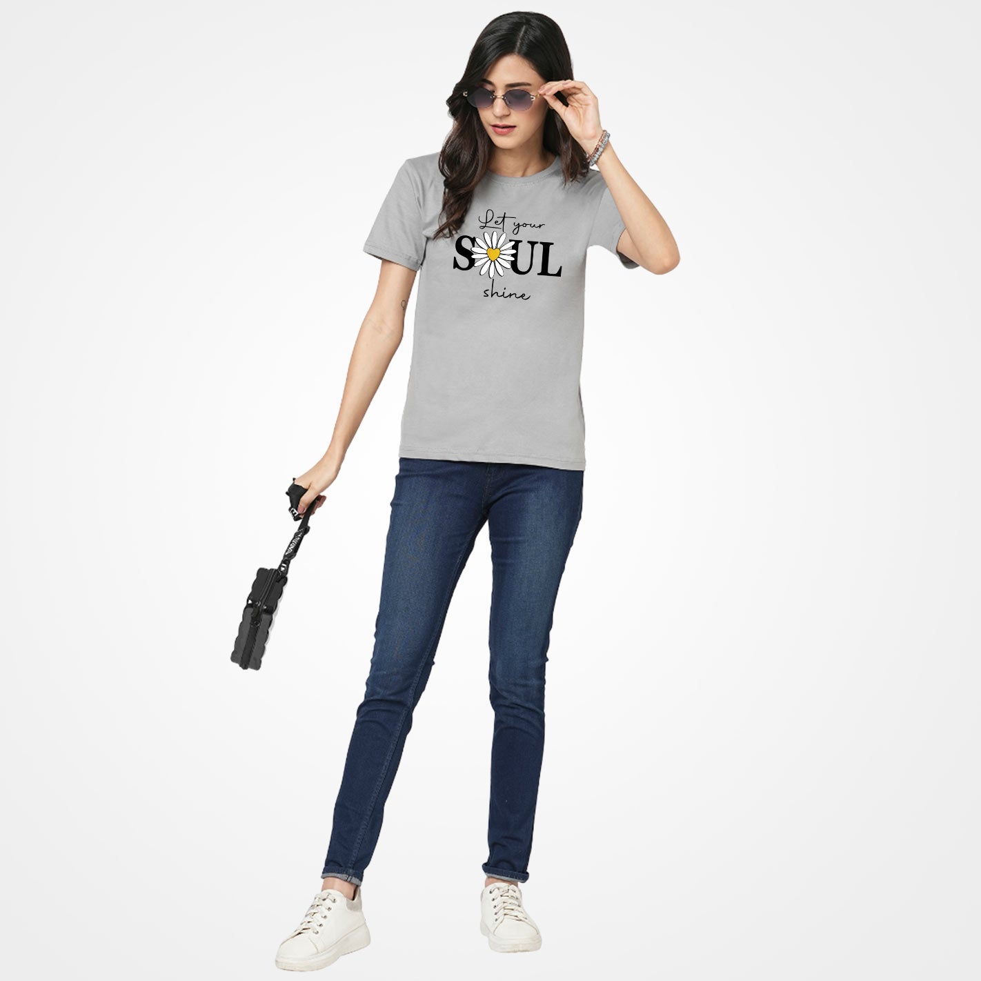 Woman wearing a Gray t-shirt by WYO with a daisy and text design on a white background