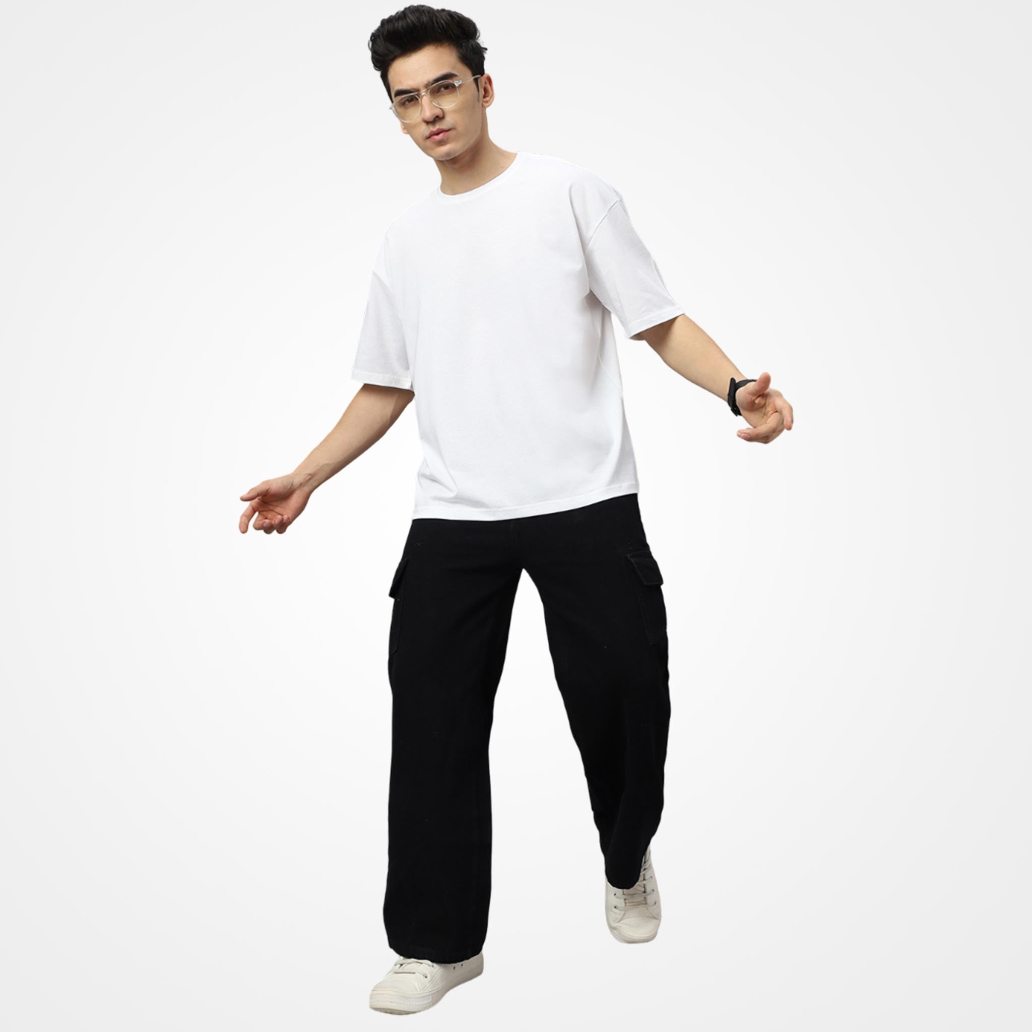 Man wearing a WYO white t-shirt and black pants on a white background