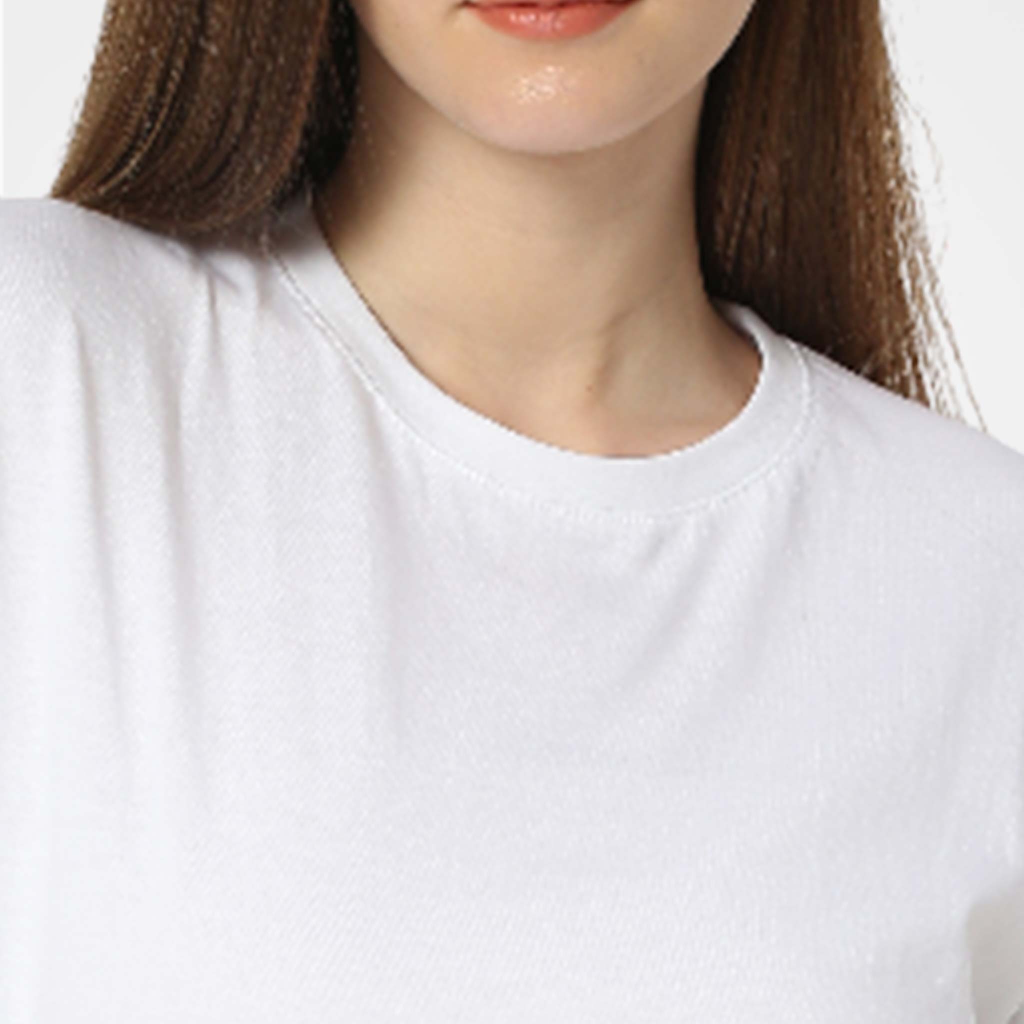 Close-up of a WYO model wearing a plain white t-shirt on a light gray background