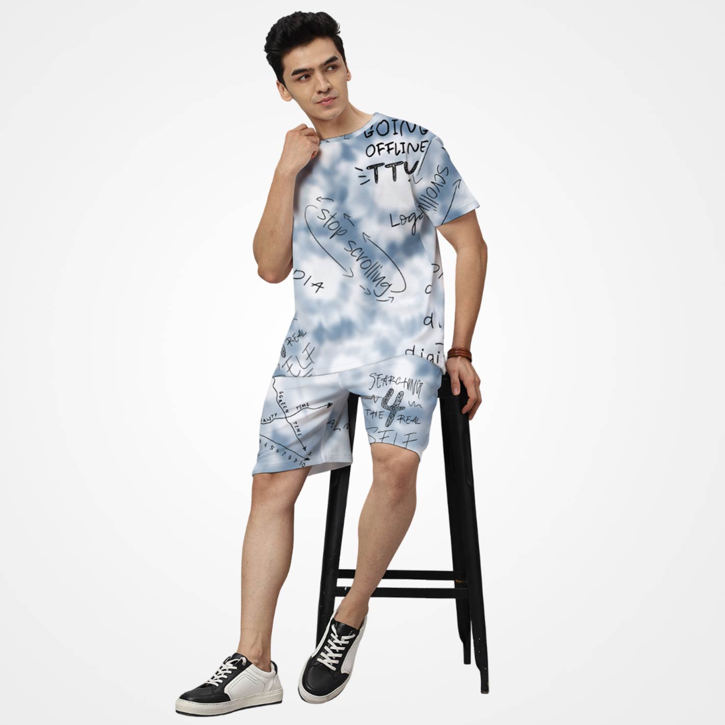 Man wearing a WYO tie-dye outfit with text design on a white background