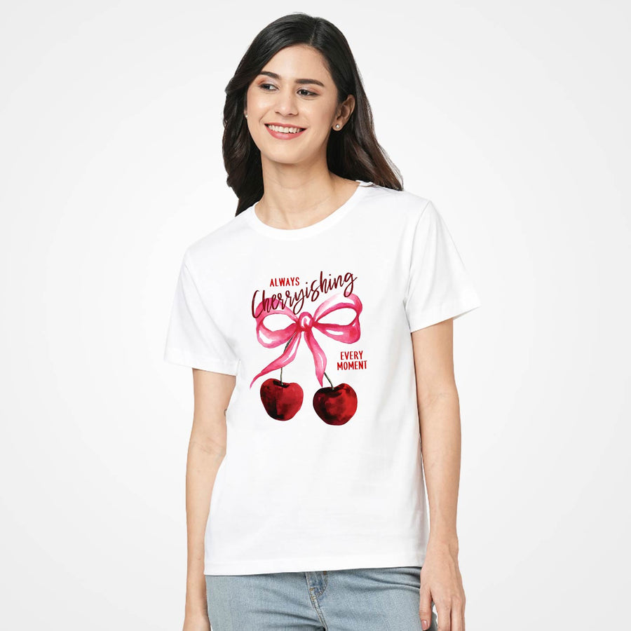 Woman wearing a WYO white t-shirt with a cherry design and text on a white background