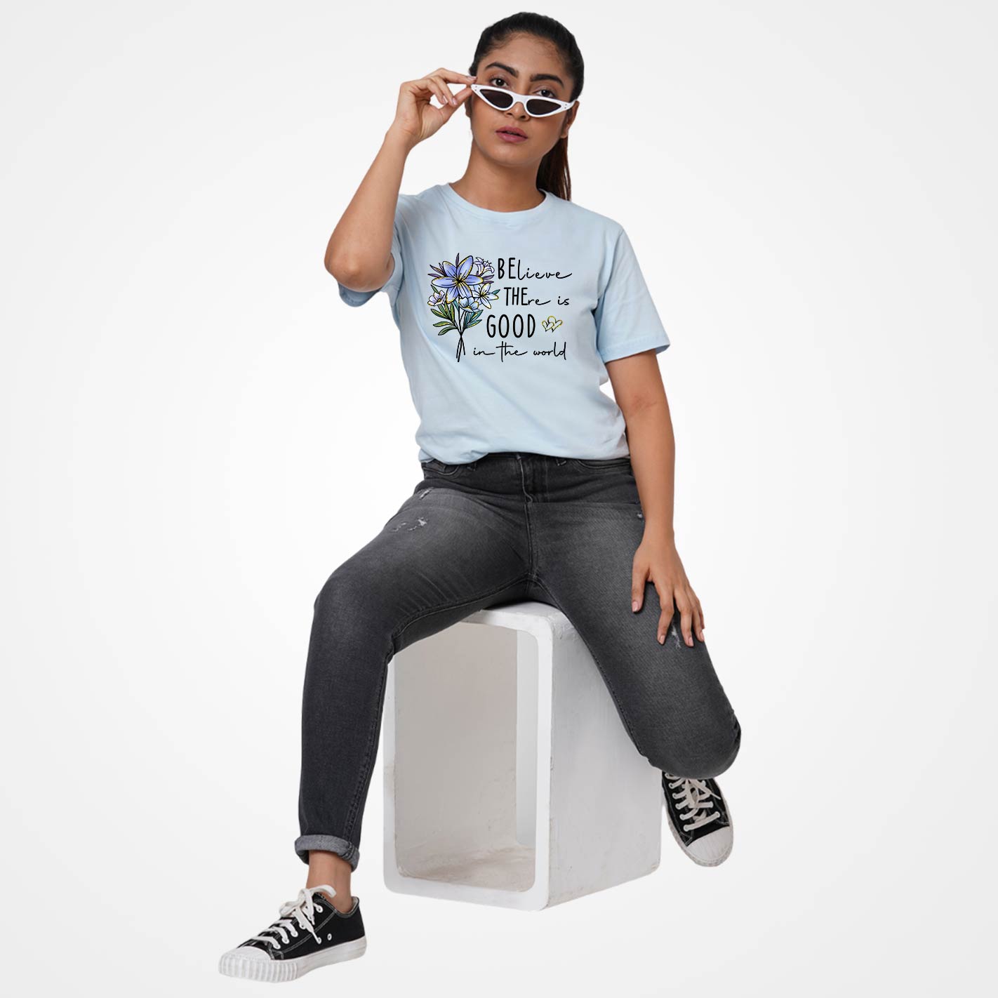 Ice blue t-shirt by WYO with floral design and text on a white background