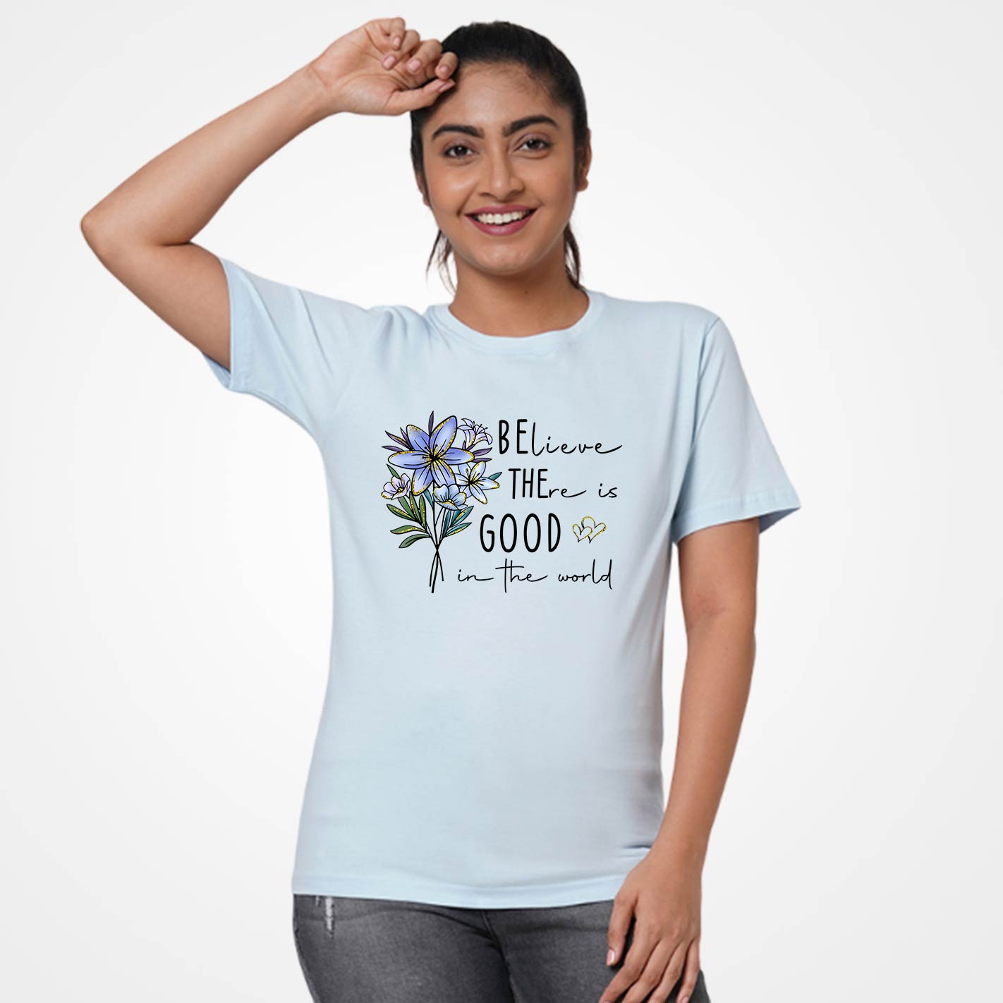Woman wearing a Ice blue t-shirt by WYO with floral design and text on a white background