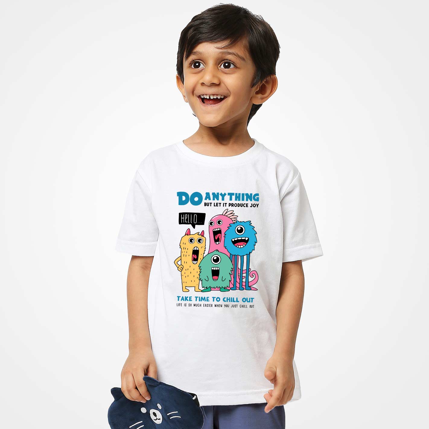 Child wearing a WYO white t-shirt with colorful cartoon characters and text on a plain background