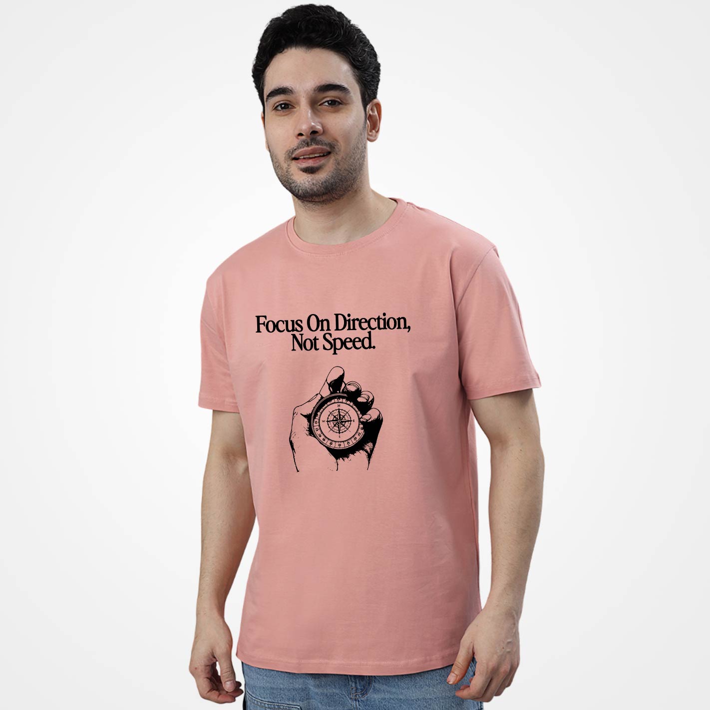 Man wearing a WYO peach t-shirt with a compass graphic and text on a white background