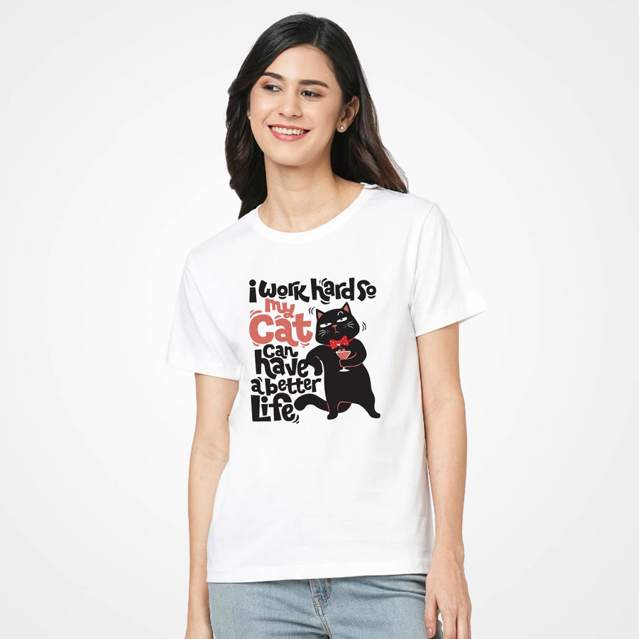 Woman wearing a WYO white t-shirt with a cat graphic and text on a plain background