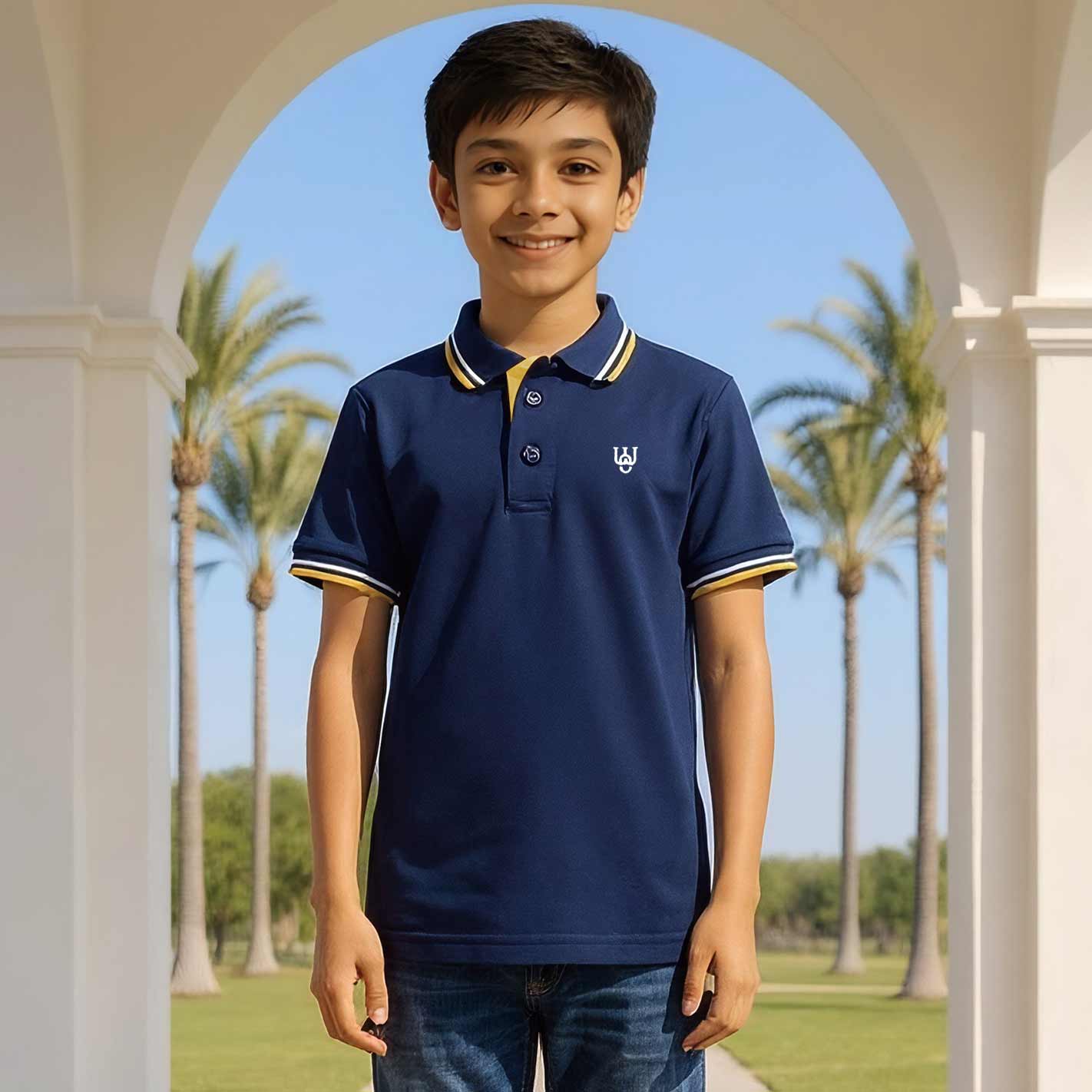 Kid wearing a WYO navy blue polo shirt with a logo, standing in front of palm trees.