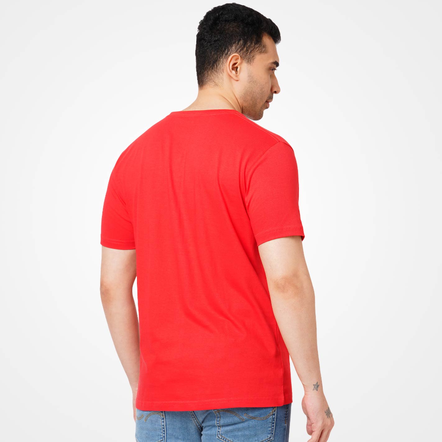 Man wearing a WYO red t-shirt on a white background