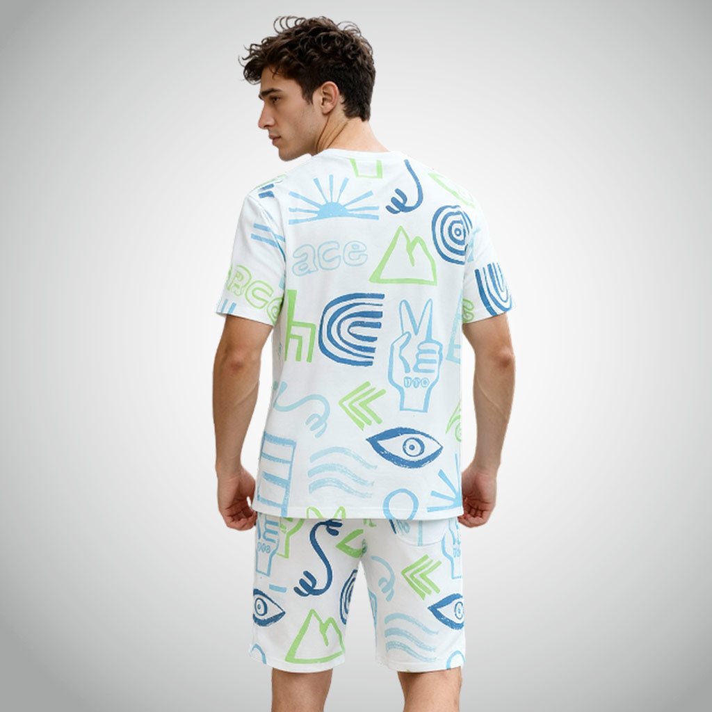 Man wearing a WYO Peace Lifestyle Co-Ord Set with colorful abstract patterns on a gray background