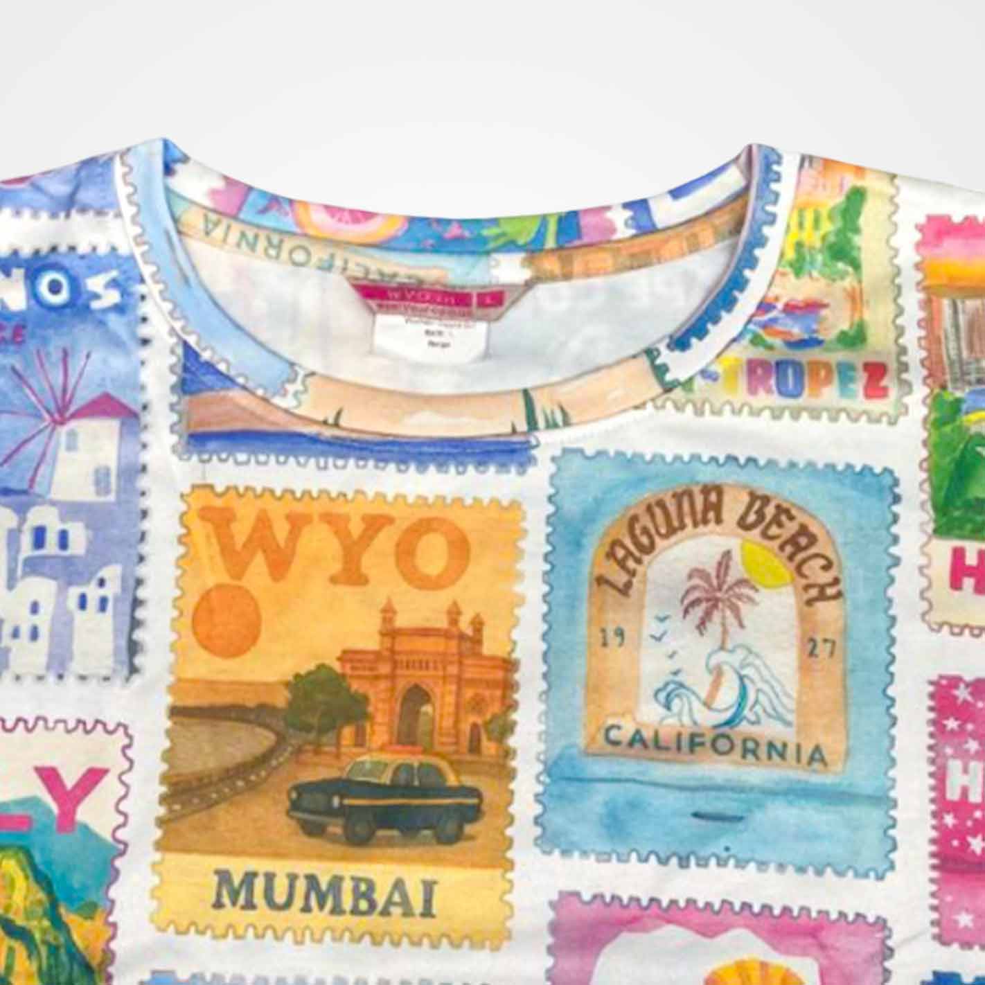 Close view of a WYO Colorful fabric with postage stamp designs featuring various locations.