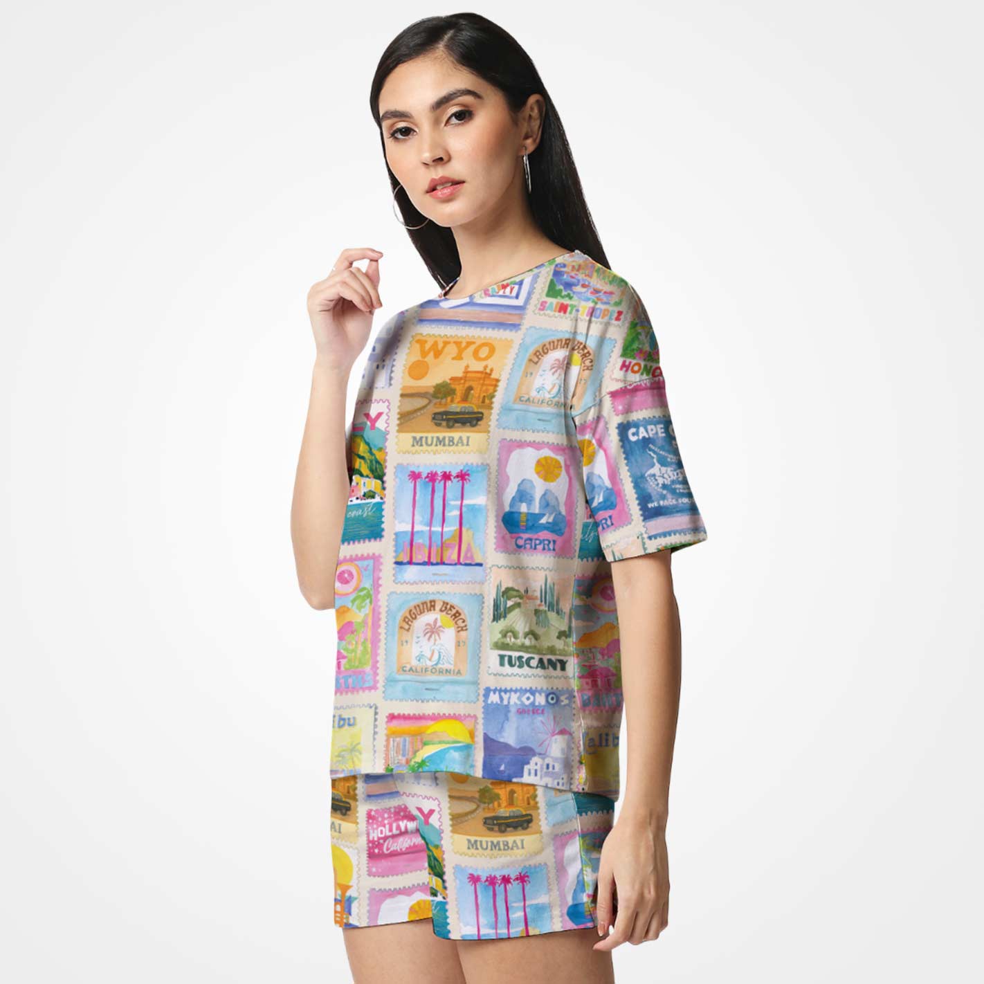 Woman wearing a WYO colorful patchwork dress with various designs and text on a white background