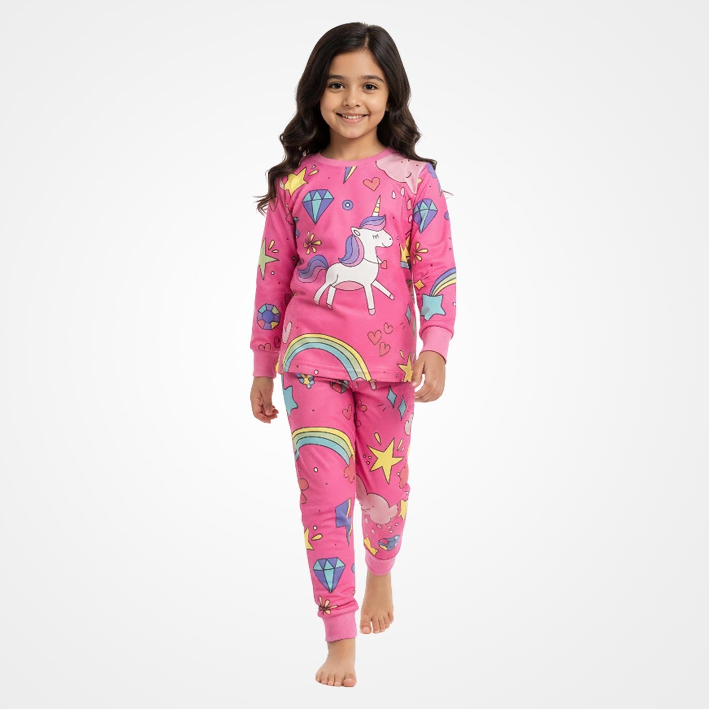 Kid wearing a WYO pink unicorn-themed pajamas on a white background